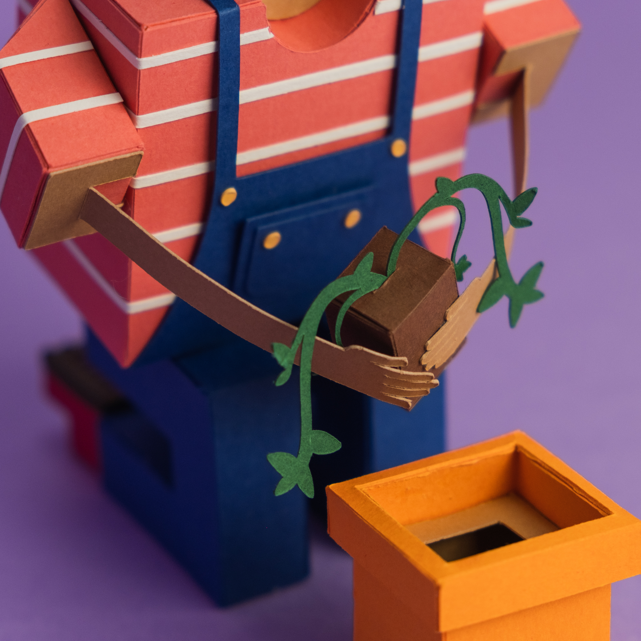 Paper Toy of a person holding a plant detail. Papercraft. Papercraft porto. Portugal arts and crafts. Original illustration Tridimentional. Character Design. Design de personagens.